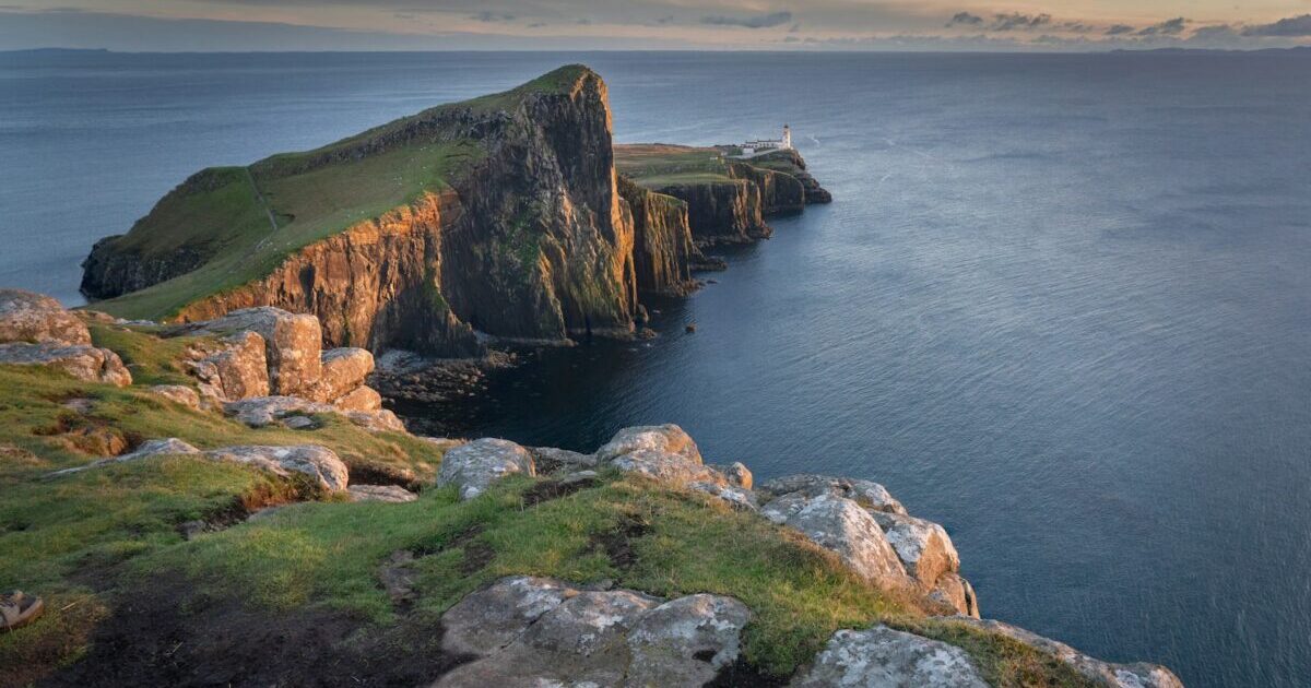 A large body of water surrounded by rocks